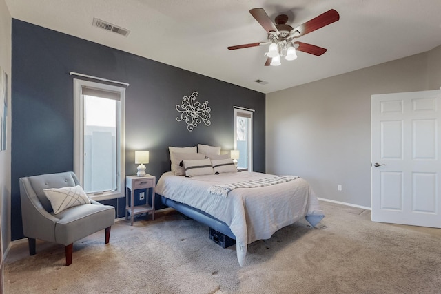 bedroom featuring ceiling fan and light colored carpet