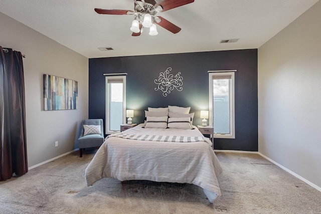 bedroom with ceiling fan and light colored carpet