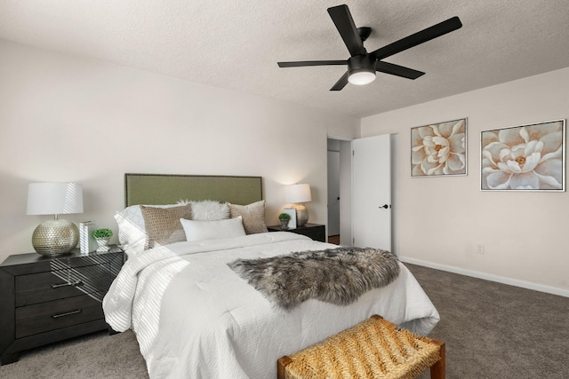 carpeted bedroom featuring ceiling fan and a textured ceiling