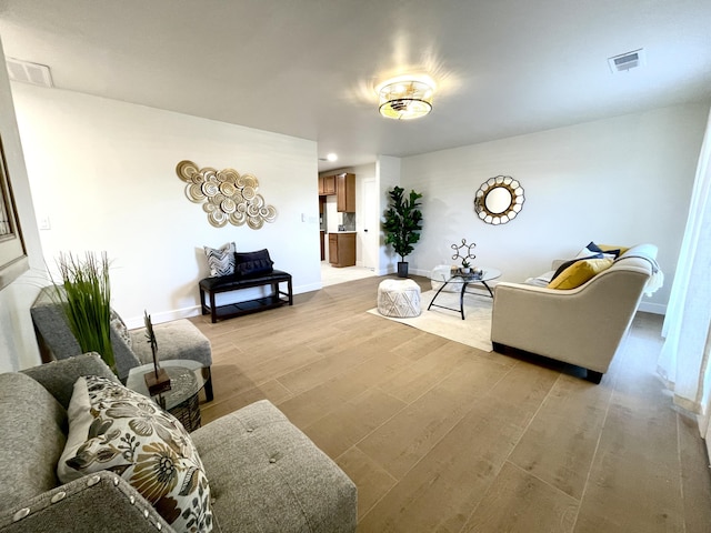 living room with light hardwood / wood-style flooring