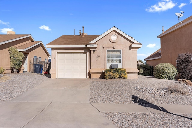 ranch-style house with a garage and cooling unit