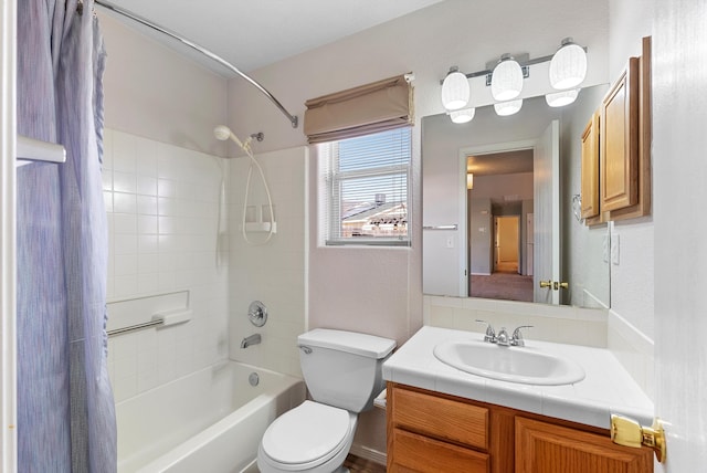 full bathroom featuring toilet, vanity, and shower / bath combo