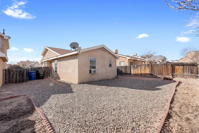 back of property featuring cooling unit