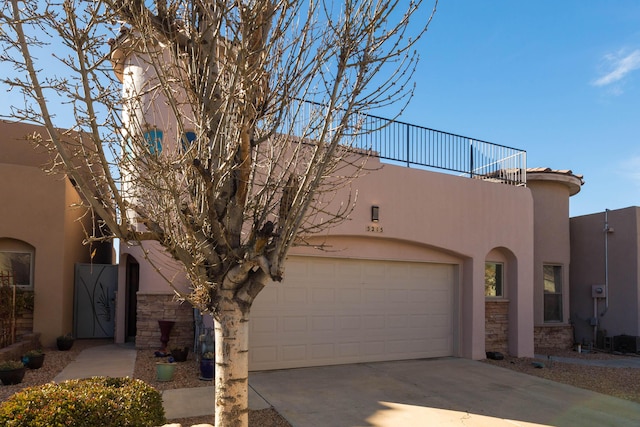 view of front of home featuring a garage and a balcony