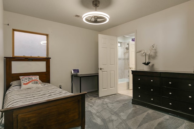 carpeted bedroom with ensuite bath