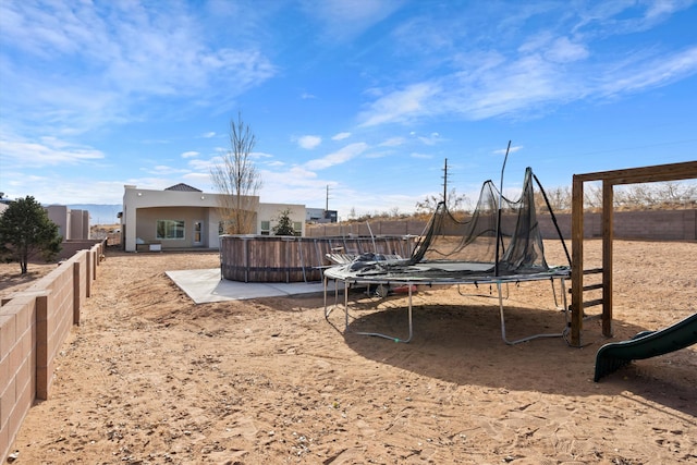 view of playground featuring a trampoline