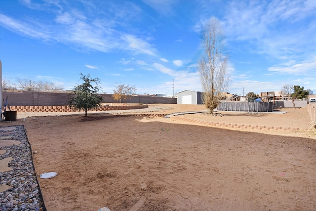 view of yard with a garage and an outdoor structure