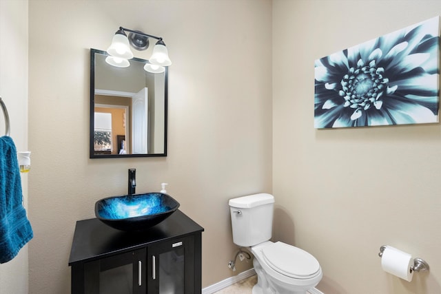 bathroom featuring toilet and vanity