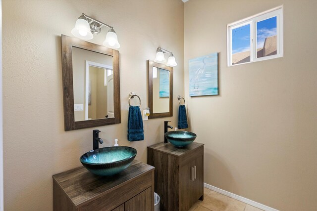 bathroom with tile patterned floors and vanity