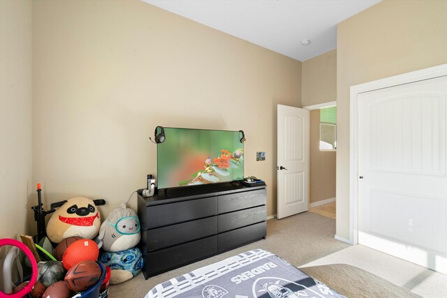 carpeted bedroom featuring baseboards