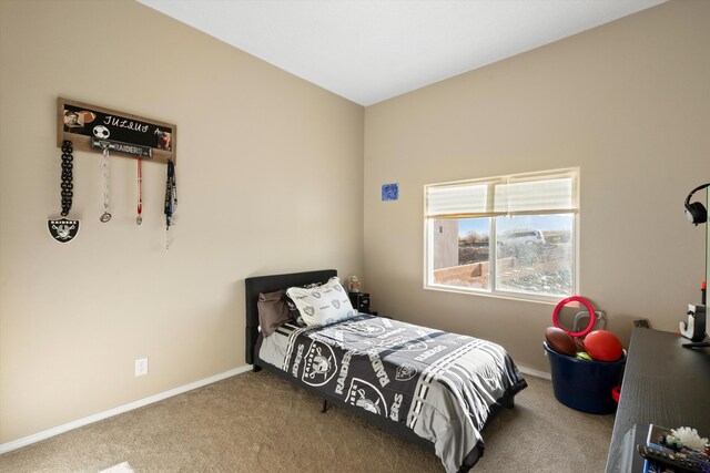 bedroom with carpet and baseboards