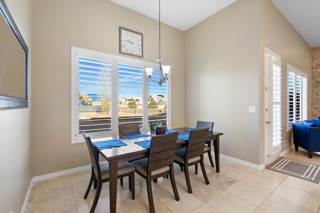 dining area with an inviting chandelier, baseboards, and light tile patterned flooring