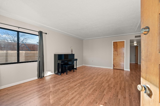 living room with hardwood / wood-style flooring and a textured ceiling