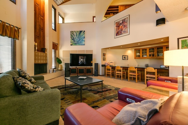 living room featuring a towering ceiling and bar