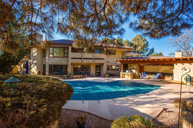 view of swimming pool with an outdoor living space and a patio