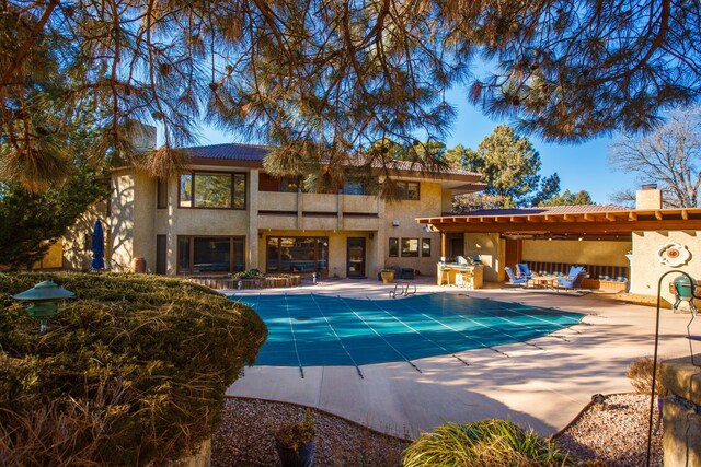 view of swimming pool with an outdoor living space and a patio