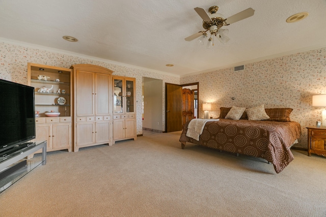 bedroom with light colored carpet, ceiling fan, crown molding, a textured ceiling, and a closet