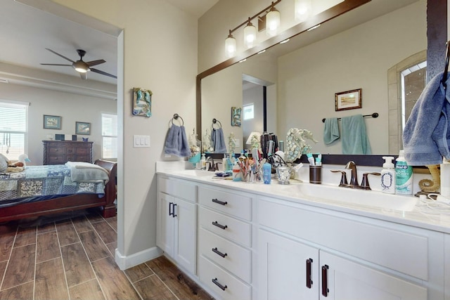 bathroom with ceiling fan and vanity