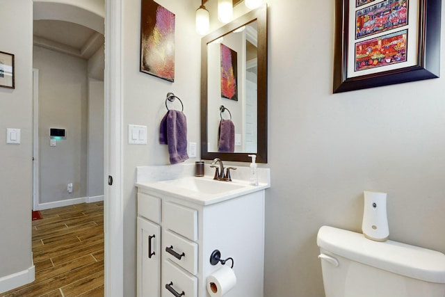 bathroom featuring toilet and vanity