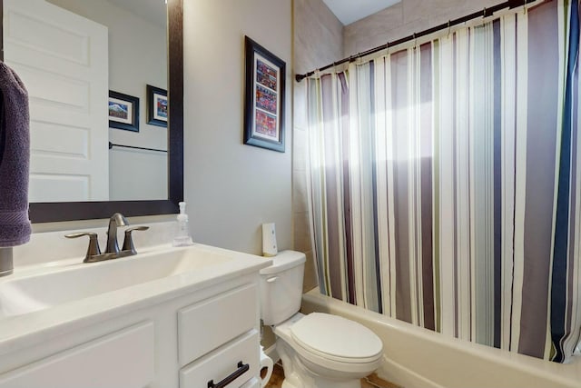 full bathroom featuring toilet, vanity, and shower / tub combo