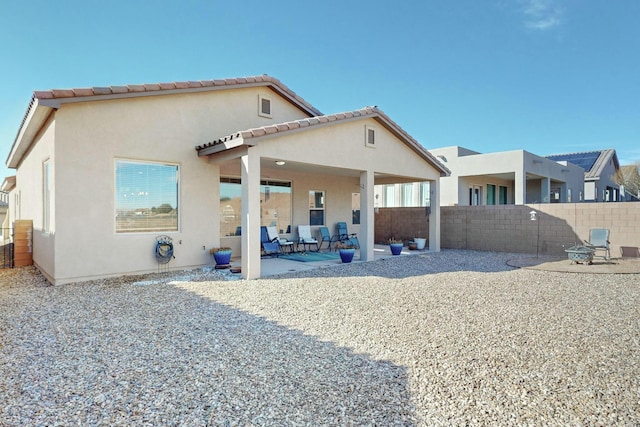 back of house featuring a patio area