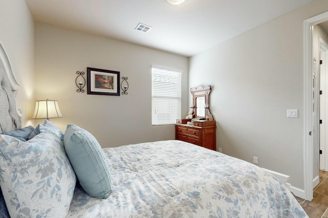 bedroom with light hardwood / wood-style floors