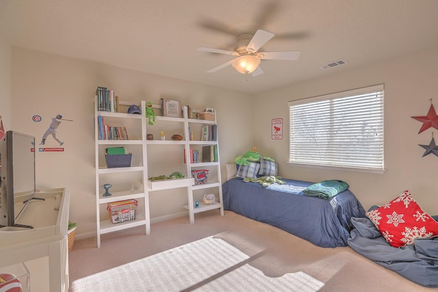 bedroom featuring visible vents, ceiling fan, and carpet floors