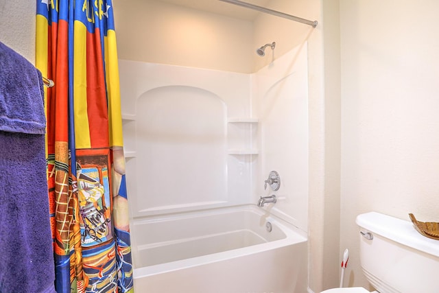 bathroom featuring shower / bathtub combination with curtain and toilet