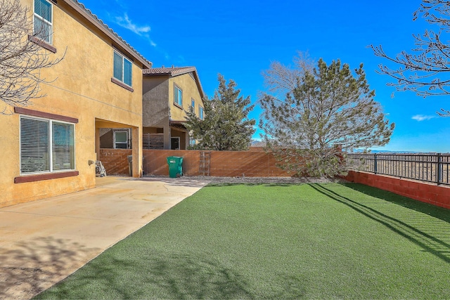 view of yard with a patio and a fenced backyard