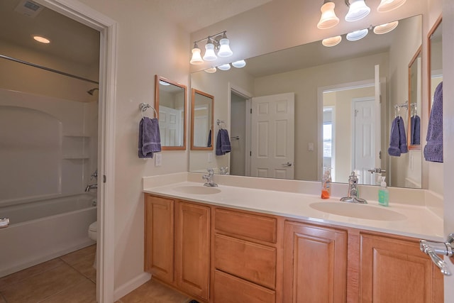 full bathroom featuring tile patterned flooring, double vanity, visible vents, and a sink