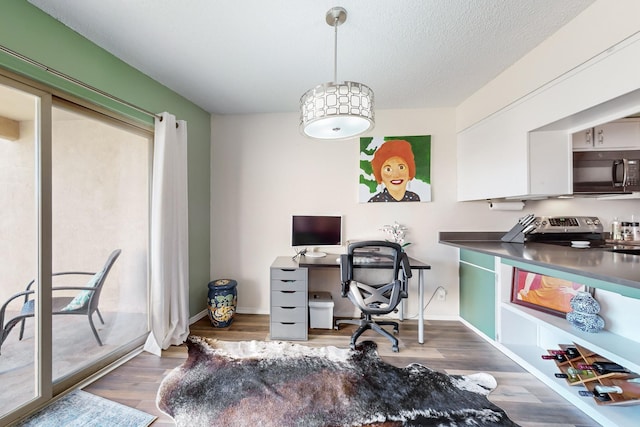 office featuring a textured ceiling and dark wood-type flooring