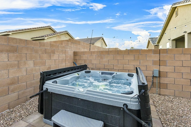 view of patio / terrace featuring a hot tub