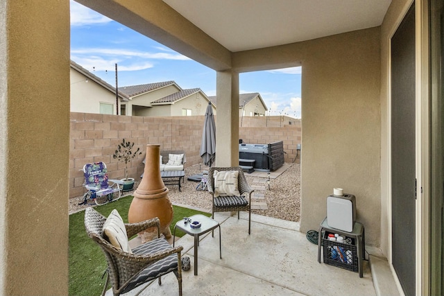 view of patio / terrace featuring an outdoor living space and fence