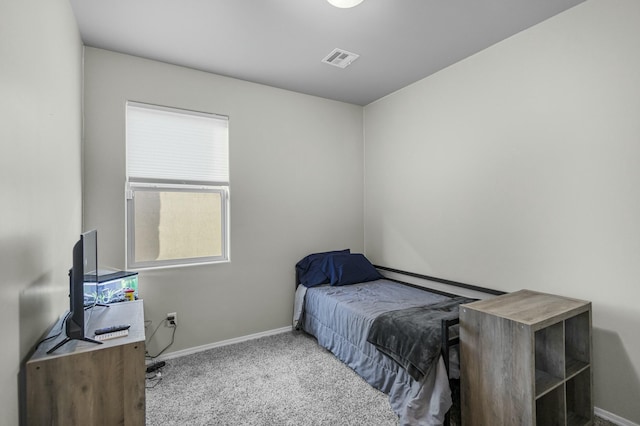 carpeted bedroom featuring multiple windows