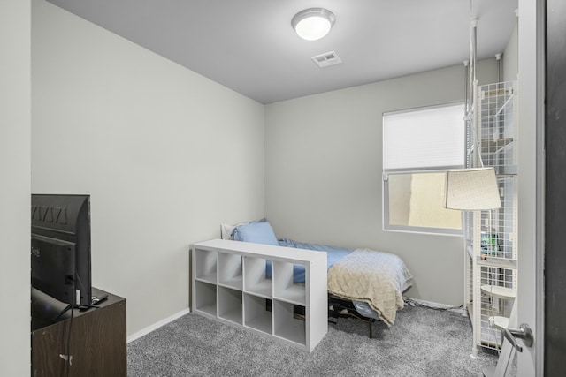 carpeted bedroom with baseboards and visible vents