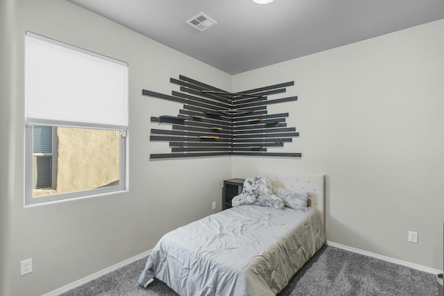 bedroom featuring dark colored carpet