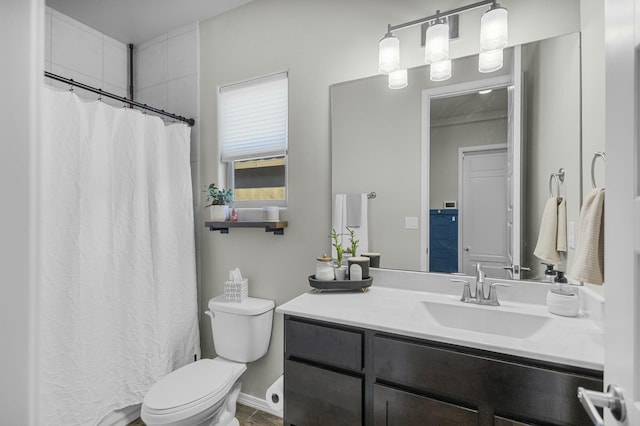 full bath with vanity, toilet, and a shower with curtain