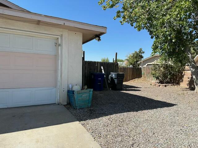 view of side of home featuring a garage