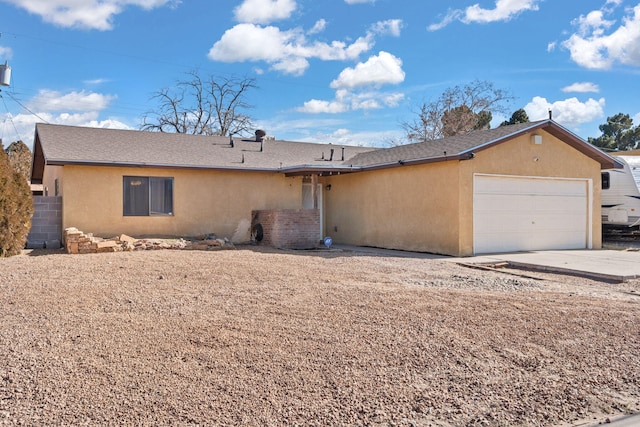 ranch-style home featuring a garage