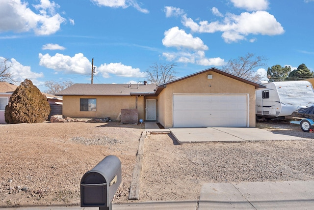 ranch-style house featuring a garage