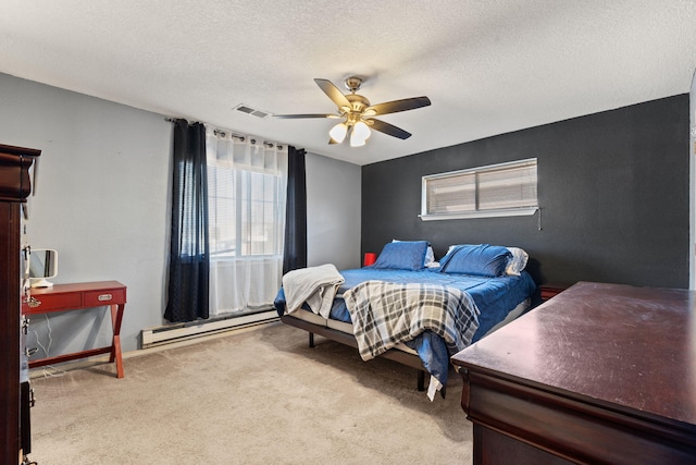 game room with a textured ceiling, ceiling fan, and carpet flooring