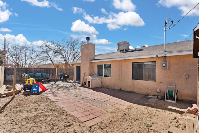 rear view of house featuring an outdoor hangout area and a patio area