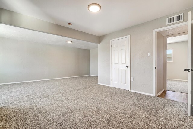 unfurnished bedroom with a closet and carpet flooring