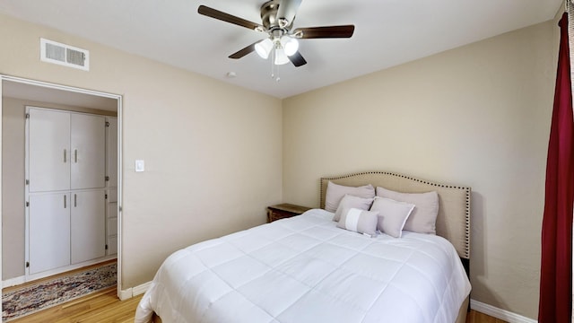 bedroom featuring ceiling fan and light hardwood / wood-style flooring