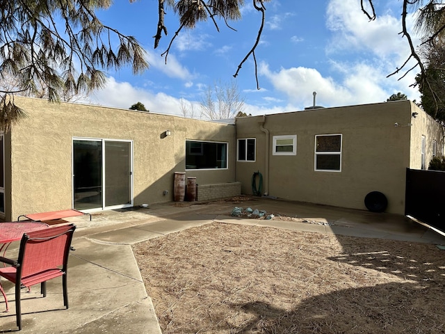 rear view of property featuring a patio area