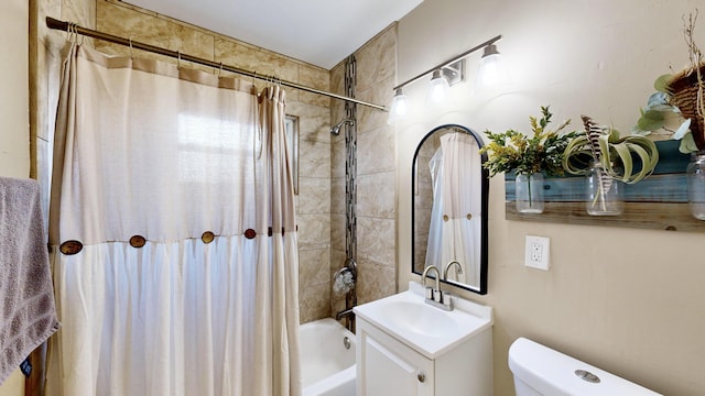 full bathroom featuring toilet, vanity, and shower / tub combo with curtain