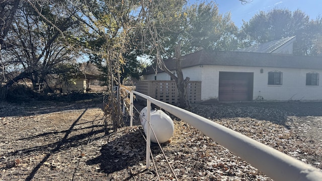 view of property exterior with a garage