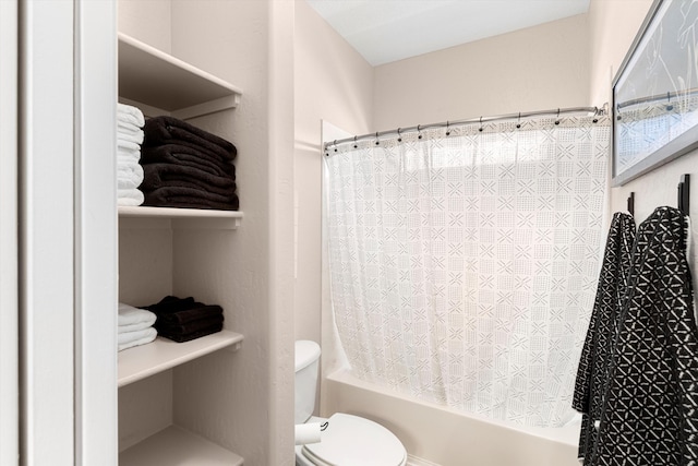 bathroom with shower / bath combo with shower curtain and toilet