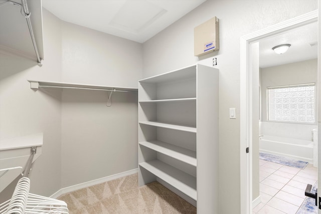 spacious closet with light tile patterned flooring