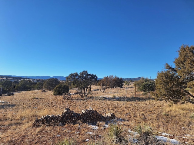 view of mountain feature with a rural view